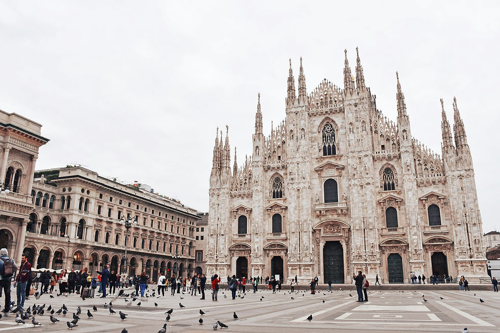 Eye-level view of the intricate façade of Milan Cathedral with detailed spires