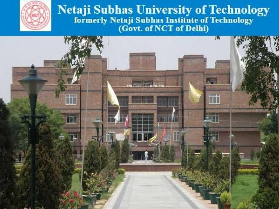 Brick university building with flags and trees lining a pathway. Blue banner reads: "Netaji Subhas University of Technology".