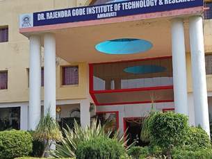 Entrance of Dr. Rajendra Gode Institute of Technology & Research, Amravati. Cream building with red accents, lush green plants, and clear sky.