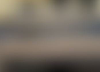 Entrance of R.H. Sapat College of Engineering at Nashik, featuring a blue sign with gold text against a cream building. Sunny day.