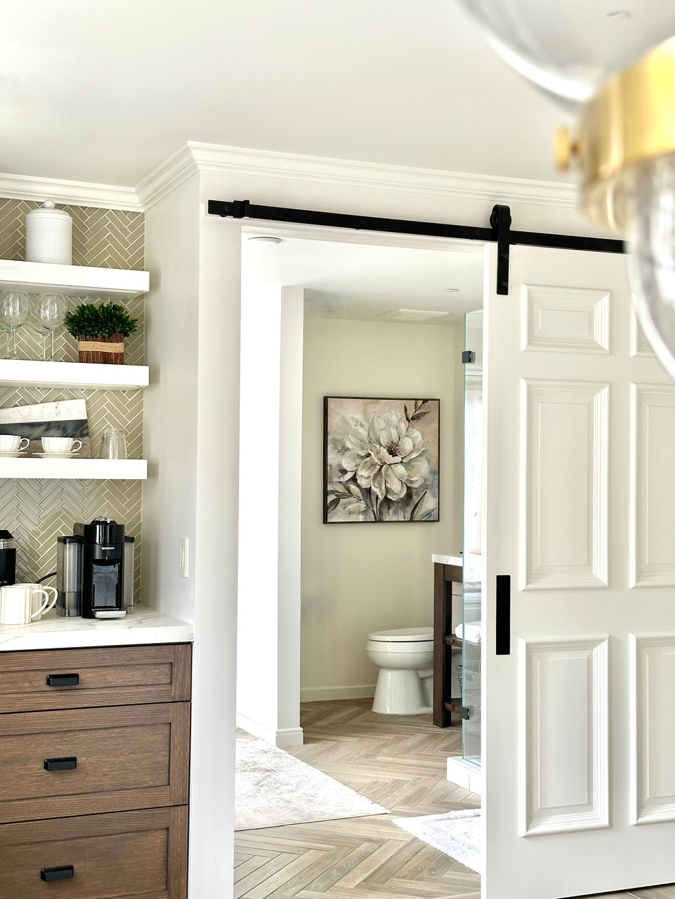 Barn door design in traditional guest room suite.