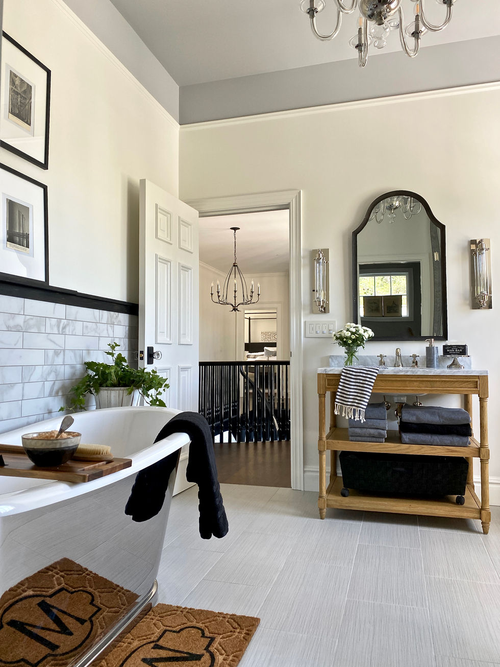 High-end masculine bathroom design with stainless steel bathtub.