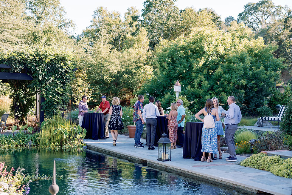 Party guests around the natural pool at Rock Haven Farm, Santa Rosa, CA