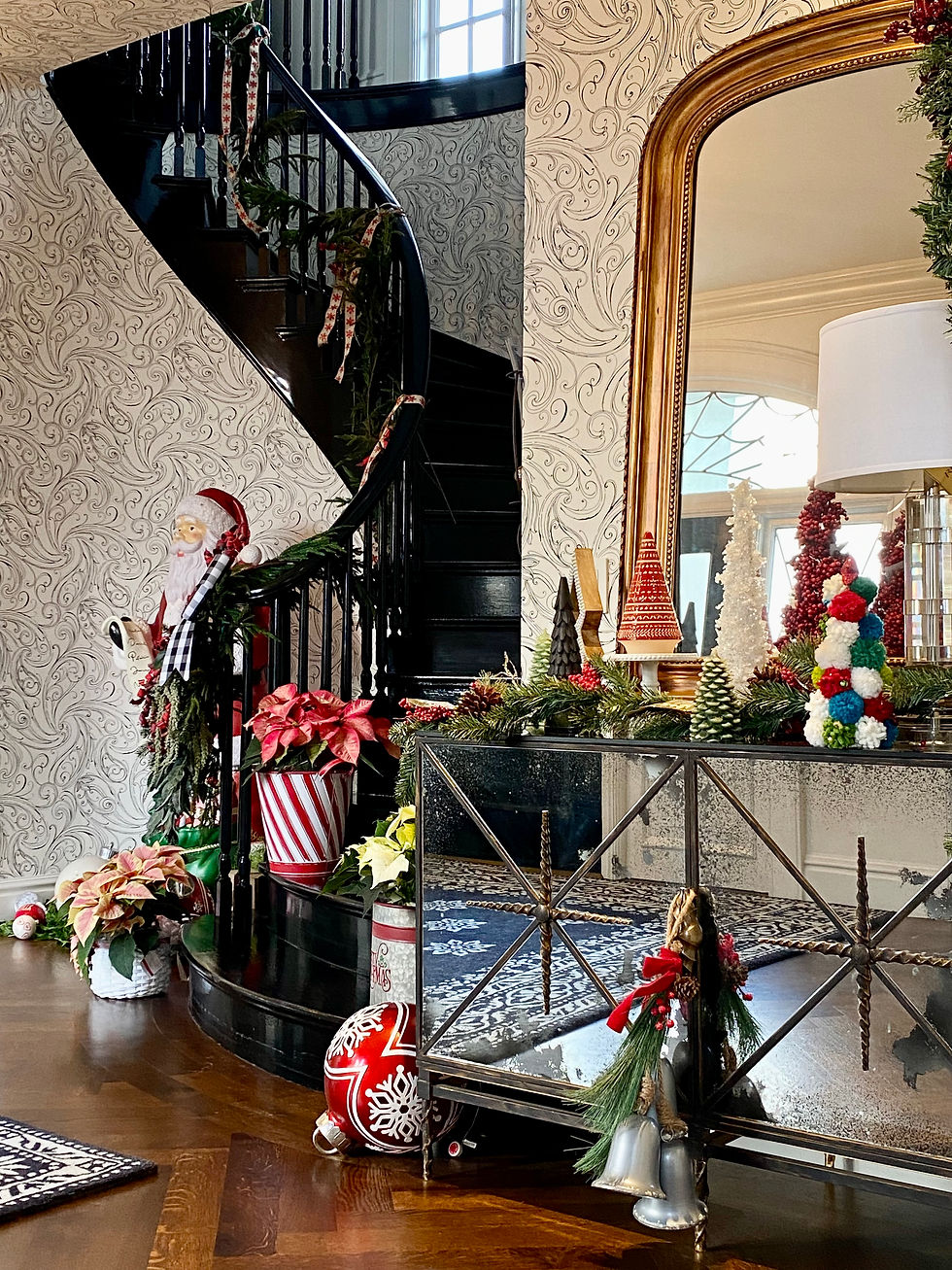 The foyer at Rock Haven Farm dressed for the holidays with traditional holiday decor.