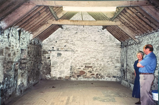 The Cornmill prior to restoration works, you can see the brickwork and centuries old beams