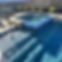 Custom Pool with Bubbler and pa Corner Spillway in Summer in Richmond, TX