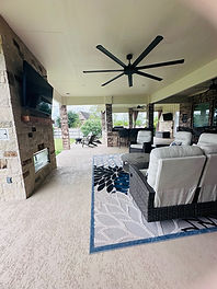 Large Attached Patio Cover with Fireplace built in Weston Lakes by Russell Outdoor Living