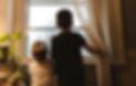 Two children looking out a bright window, representing future-focused homeownership through SmartBuy™ DPA and Click n’ Close