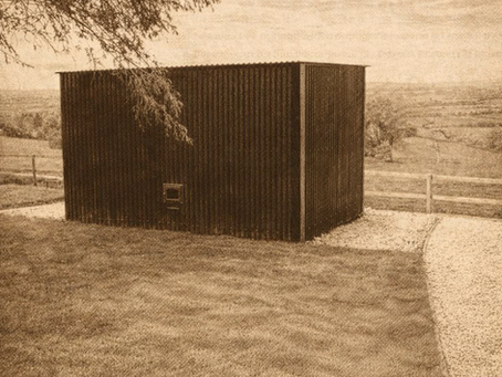 A sepia sketch of a sauna overlooking the countryside