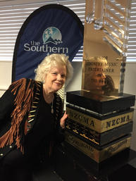 8. Sally Posing with NZCMA trophy.jpeg