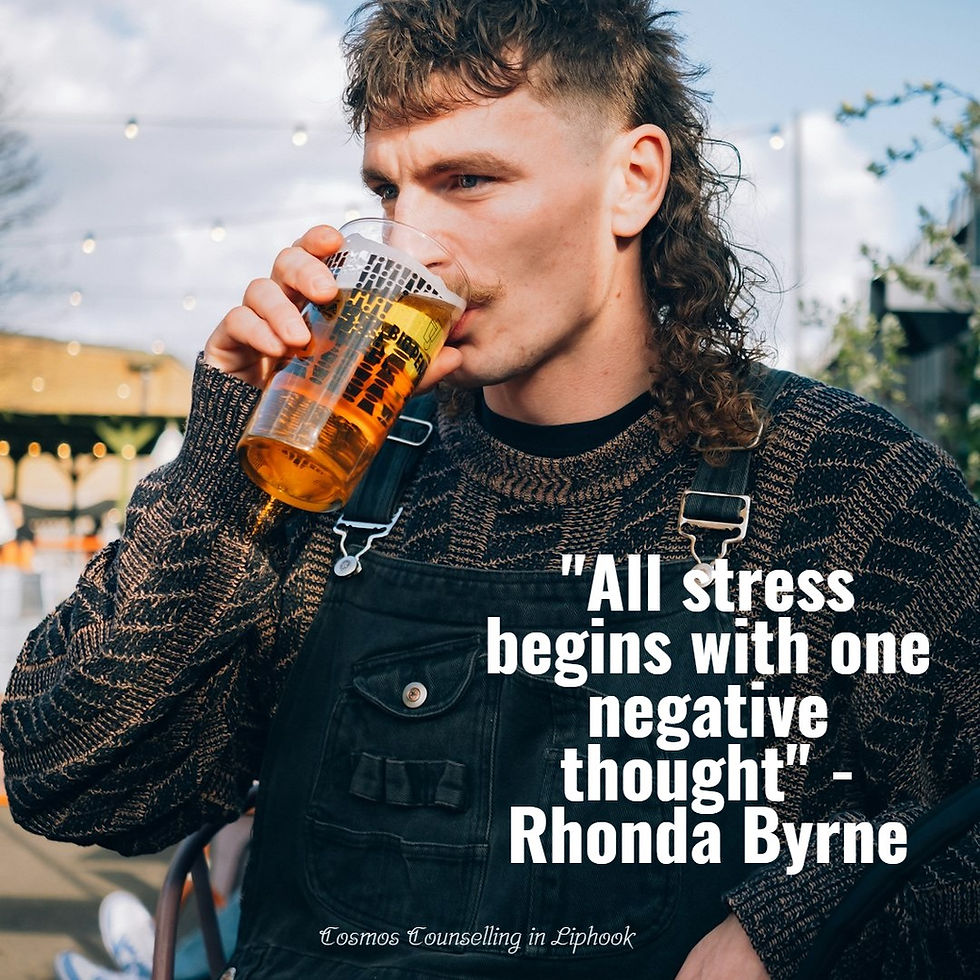 Young man drinking a pint of beer.