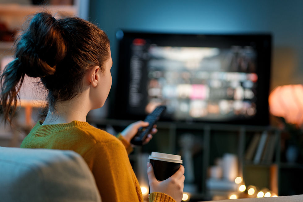 Woman watching streaming content at home, reflecting how fans are keeping up with the rapid growth of Thai GL series.