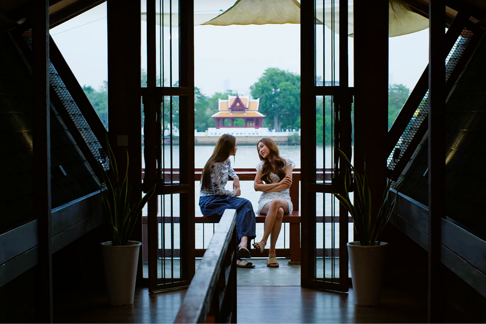 Prim and Bambi sit by the river during an emotional conversation in Girl Rules Episode 10, framed between shadows and light to reflect Bambi’s difficult healing journey.