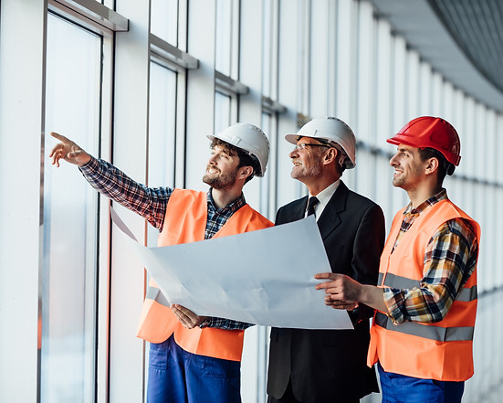 architect-man-showing-something-project-his-colleague-foreman.jpg
