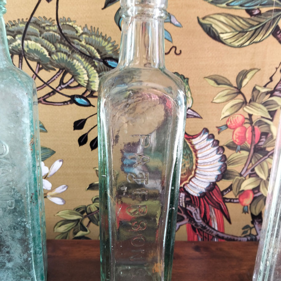 Antique late 19th or early Victorian 20th century set of 4 green bottles