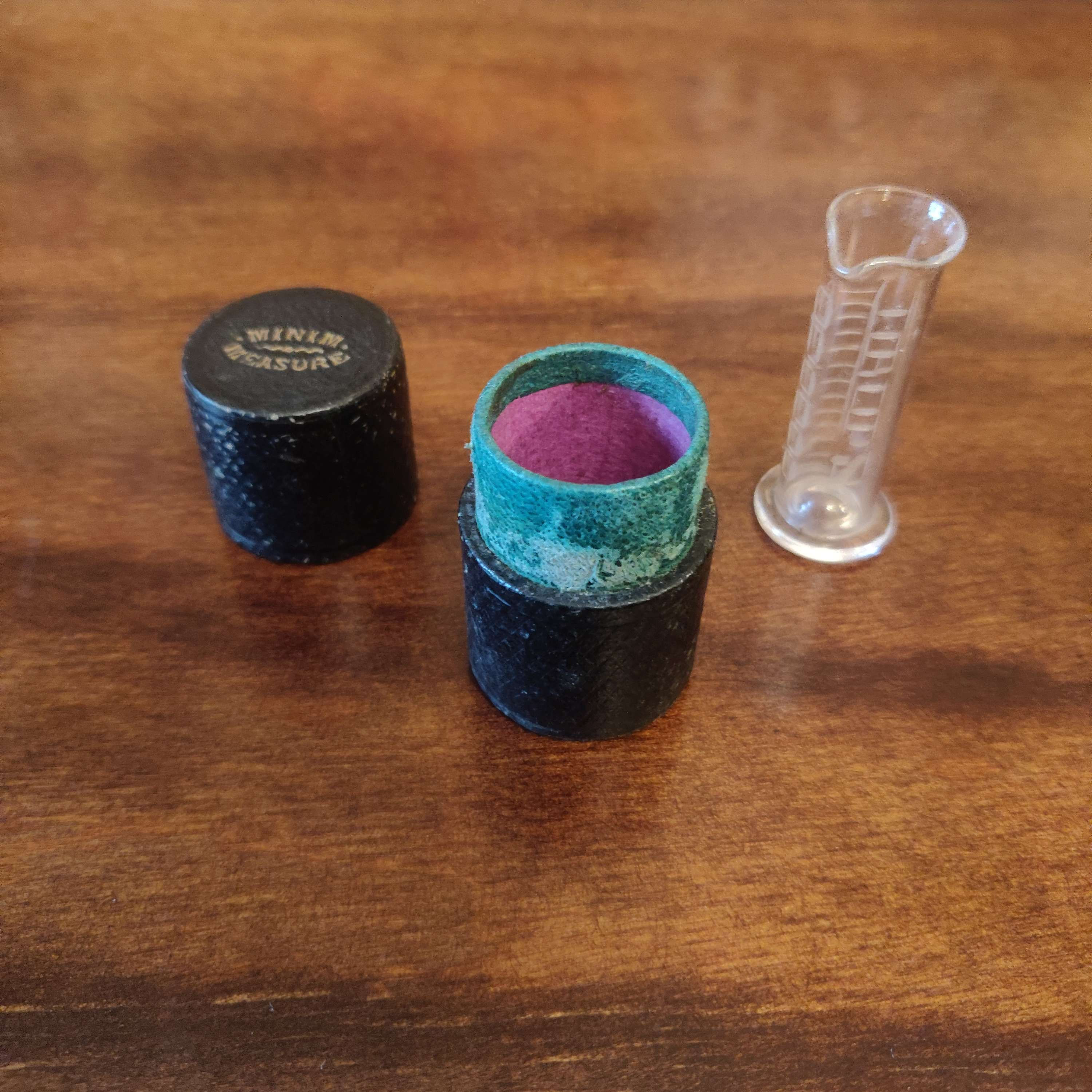 Vintage minim measure by TW London in leather case