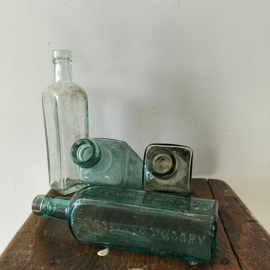 Antique late 19th or early Victorian 20th century set of 4 green bottles