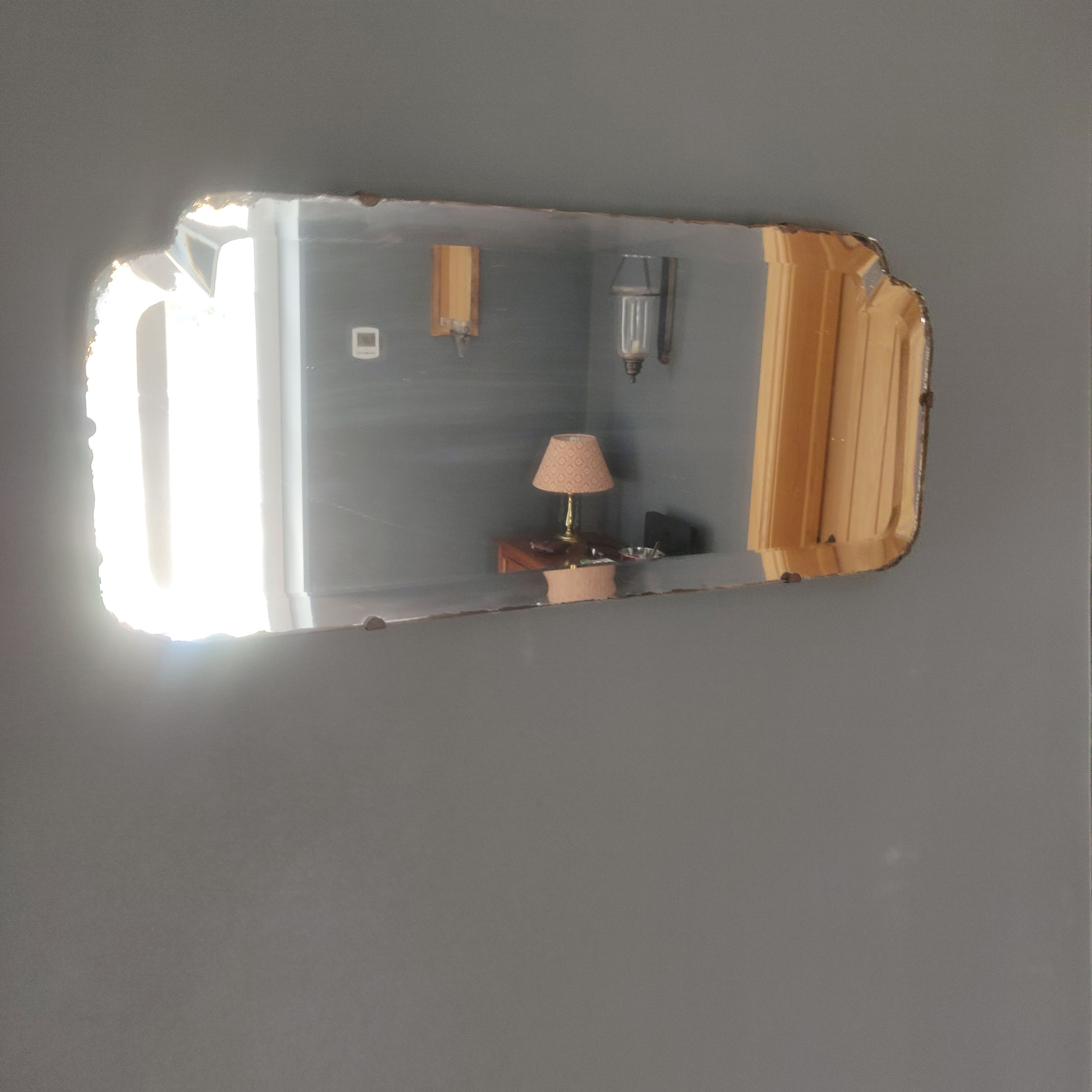 Antique early 20th century art deco bevelled edge unframed mirror with oak back