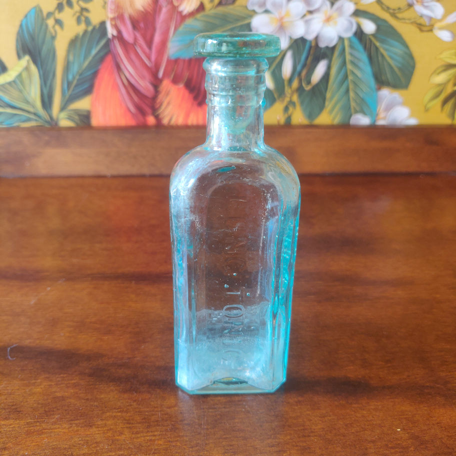 Antique early 20th or late 19th century Owbridge lung tonic bottle with lid