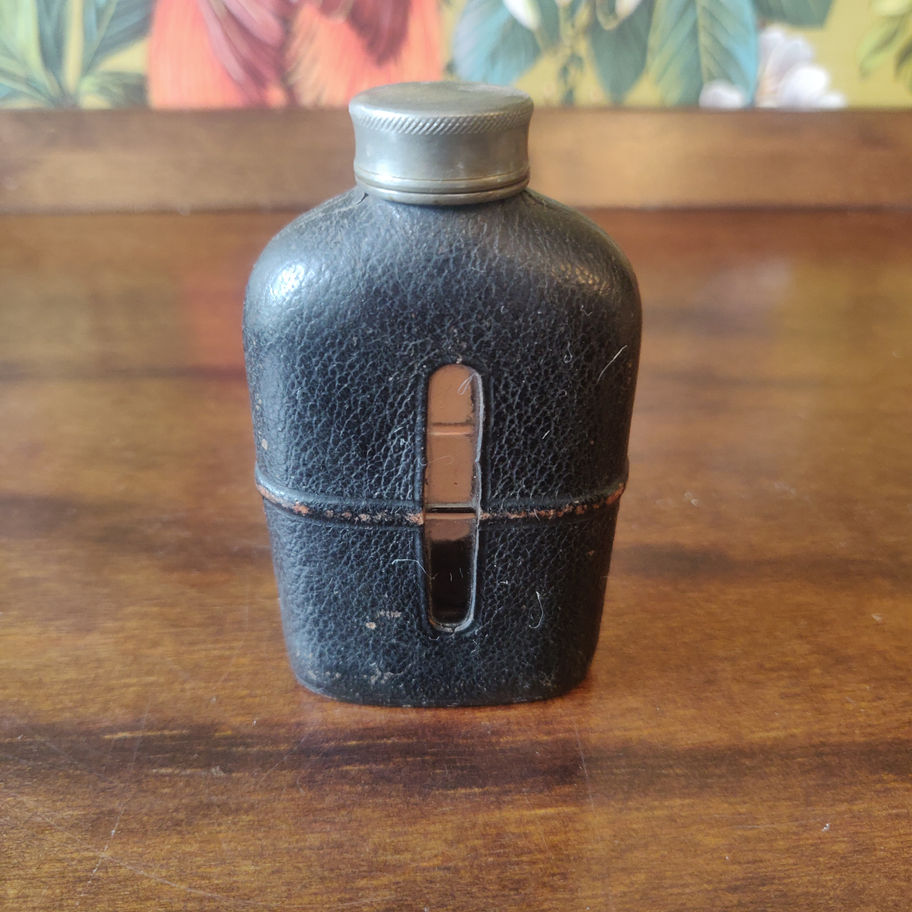 Vintage small leather bound glass with pewter screw top hip flask