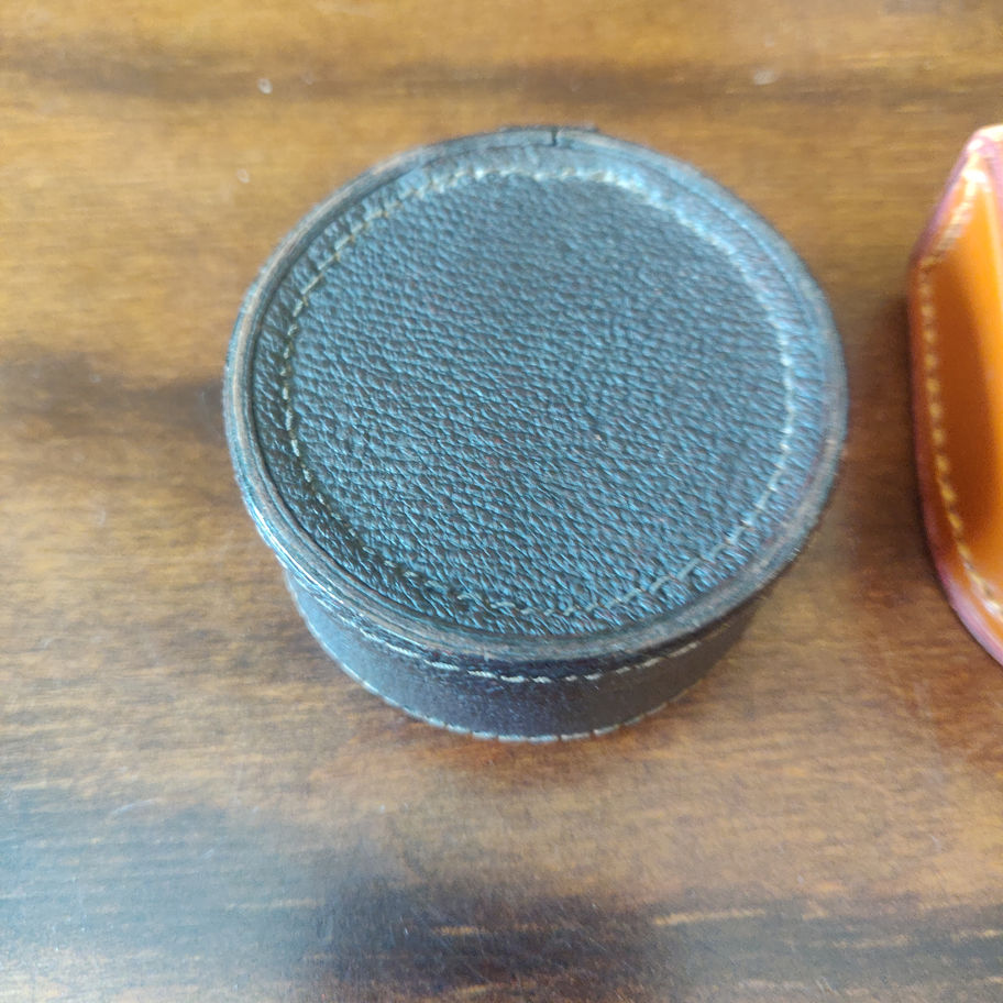 Vintage pair of leather cuff link boxes one by Studs and one by AF?