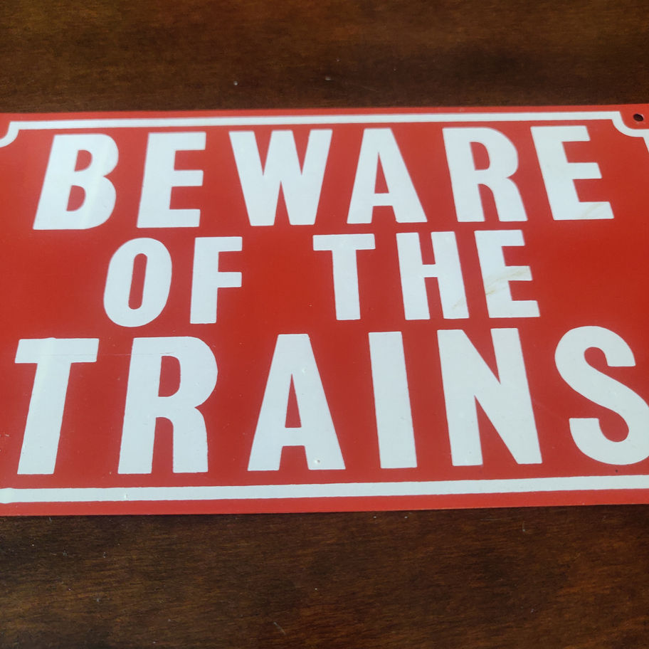 Metal Beware of the Trains sign