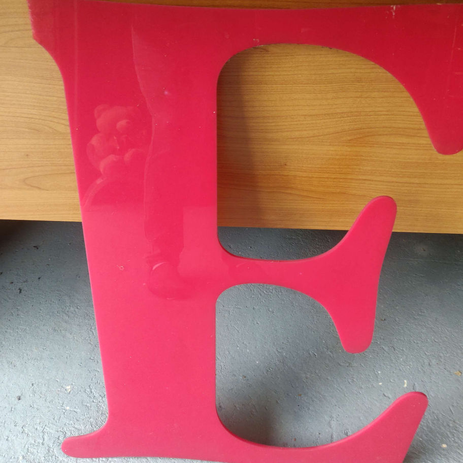 Large red perspex letters