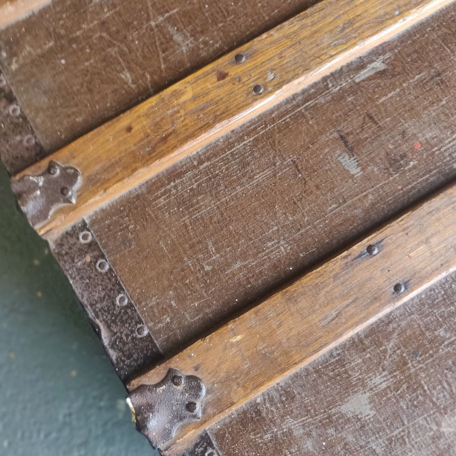 Antique early 20th century or late 19th century oak and cast iron bound trunk
