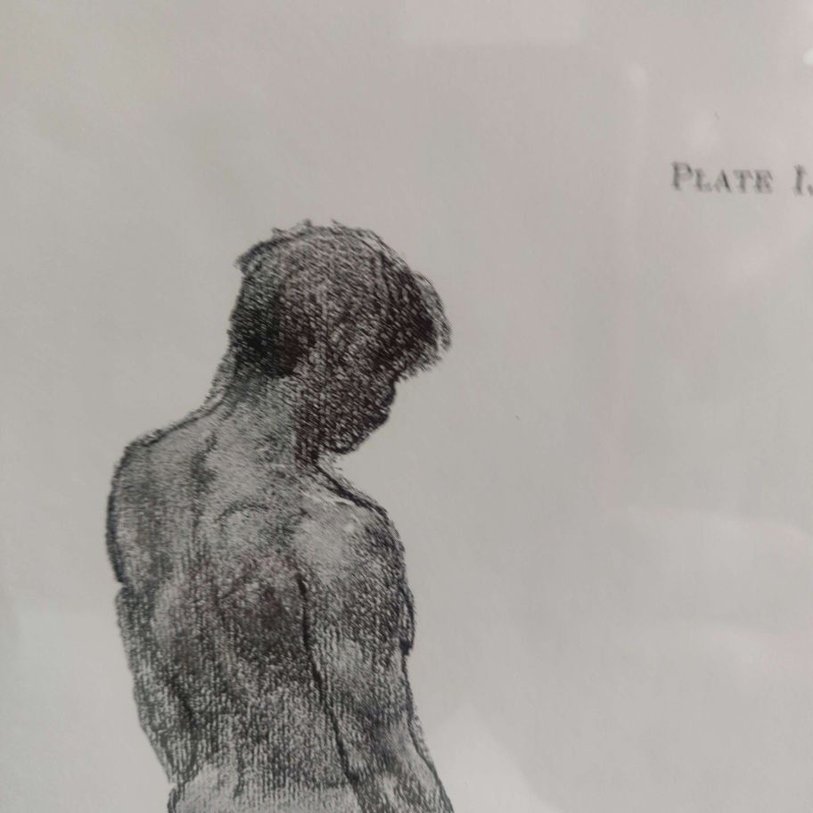 male figure in charcoal in black frame