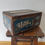 縮圖：Vintage May be older oak lidded box adorned with Liberty and shoe related signs