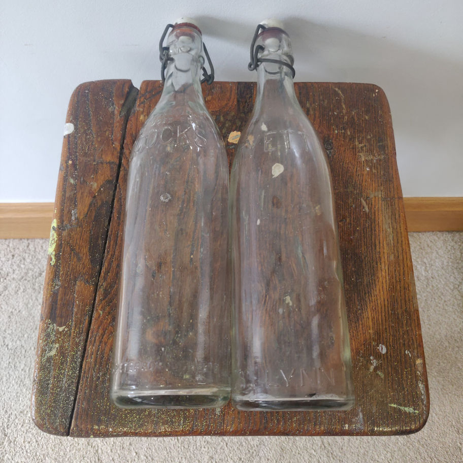 Vintage pair of glass bottles with original stoppers Bestyett & Adcocks