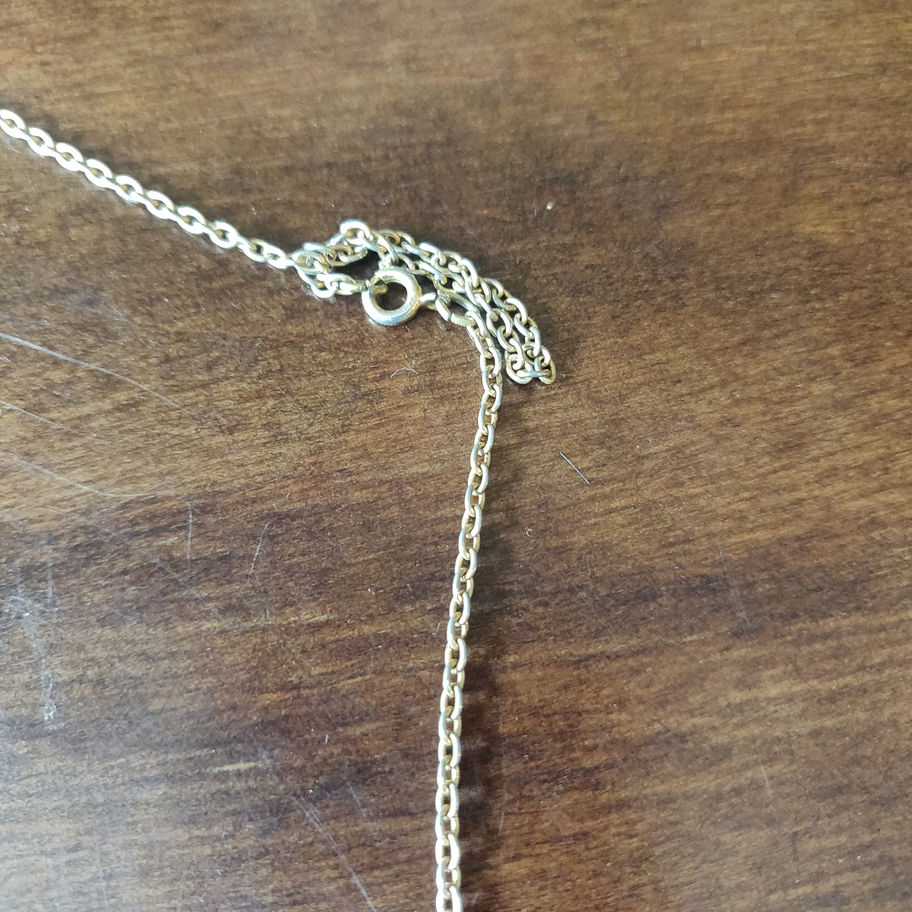 Vintage magnifying glass on a chain jewellers loupe
