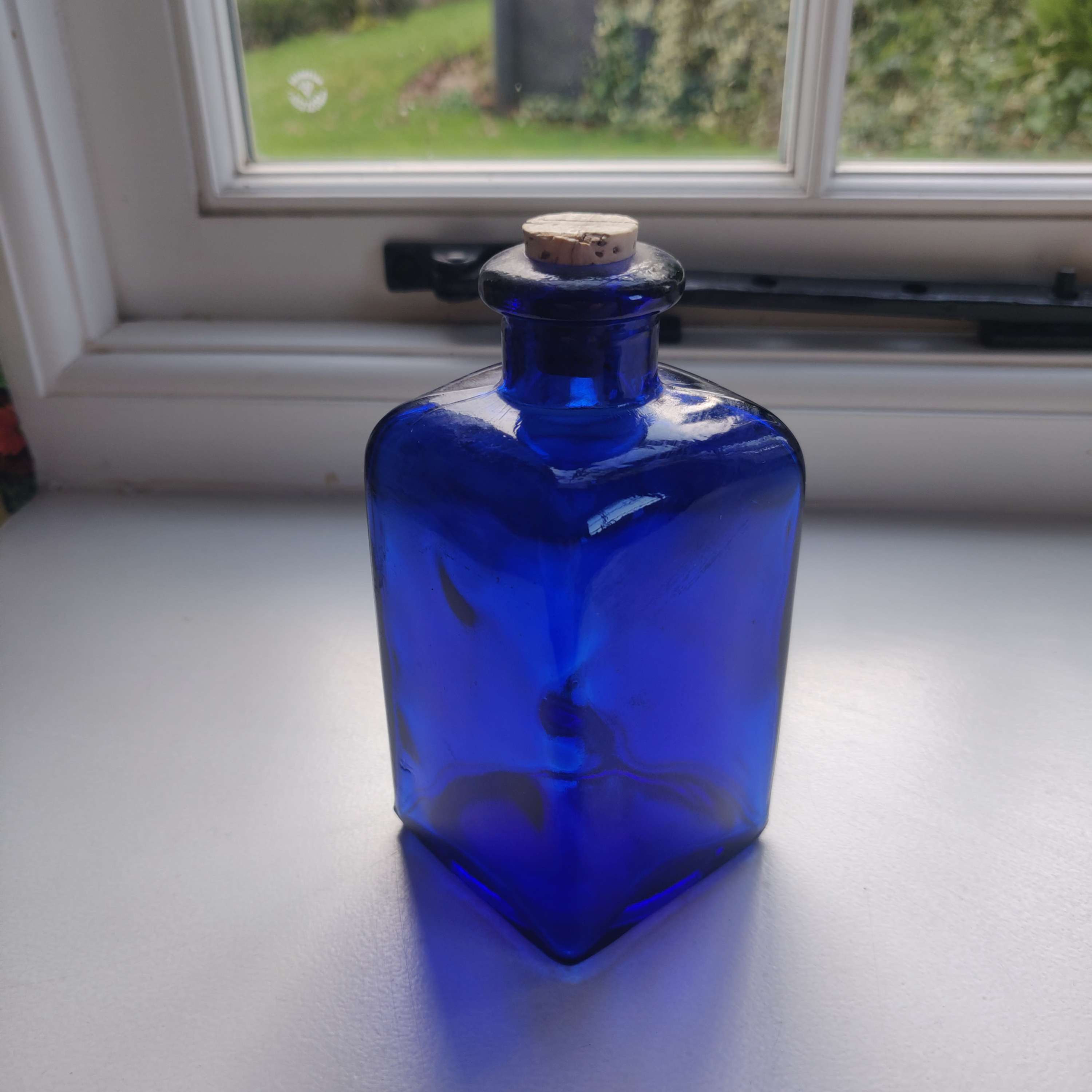 Vintage small cobalt blue bottle with cork stopper