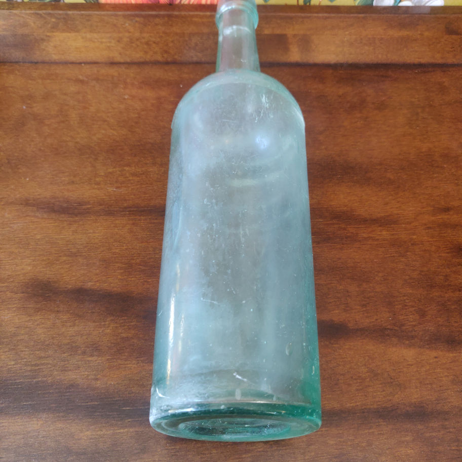 Vintage large green decorative glass bottle