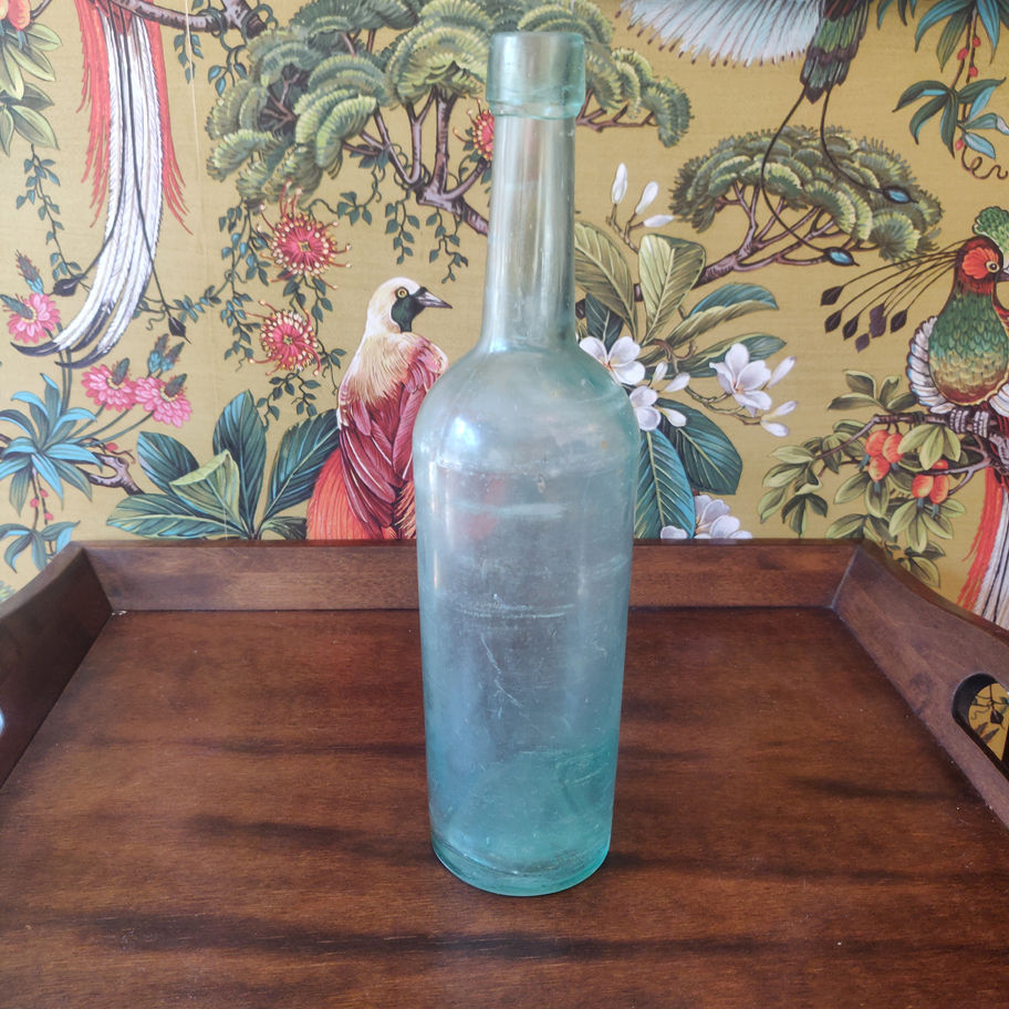 Vintage large green decorative glass bottle