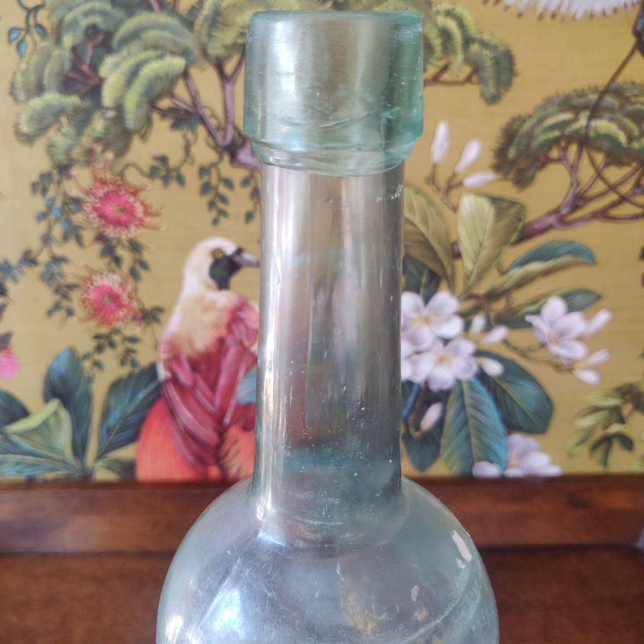 Vintage large green decorative glass bottle