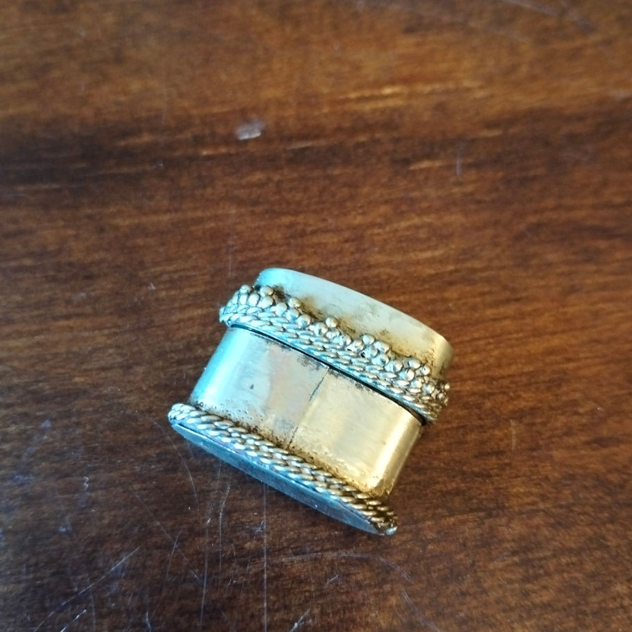 Vintage small metal pill box with opaline or possibly mother of pearl lid