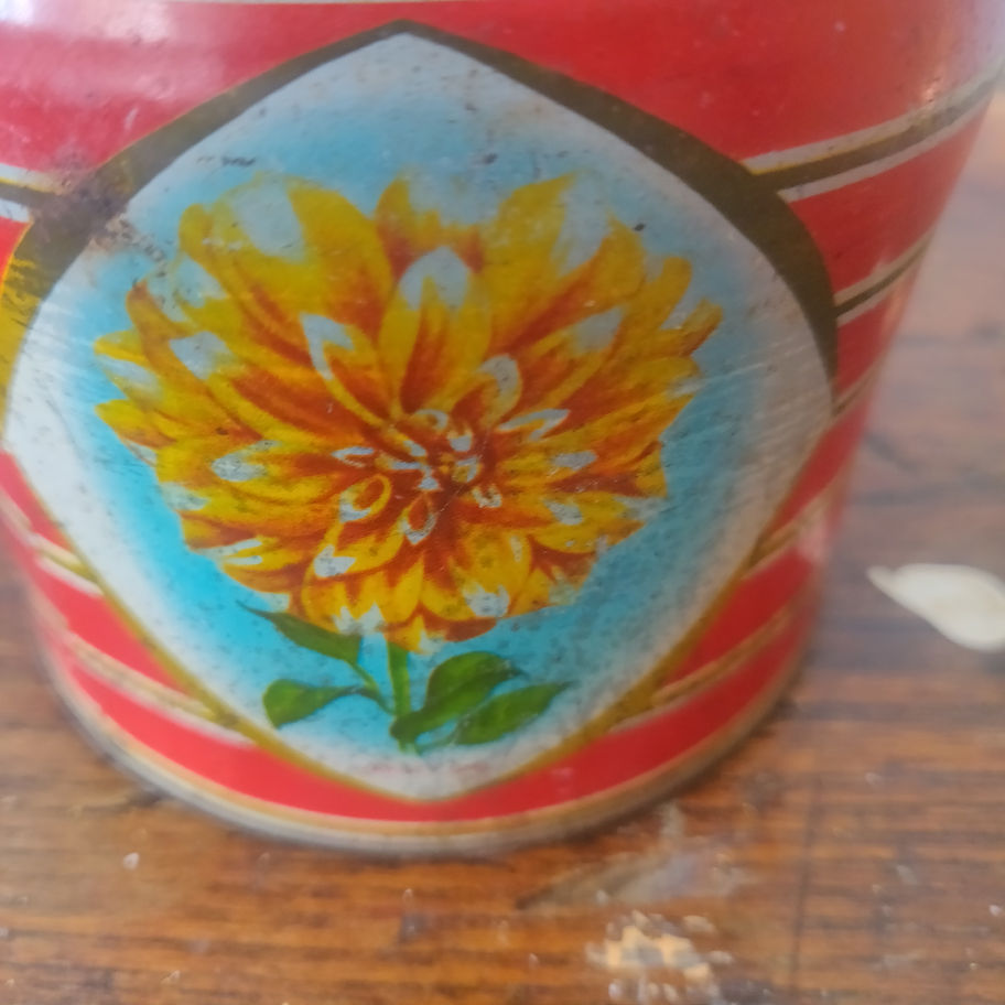Vintage Kemp's chocolate biscuit tin showing Dahlia flowers