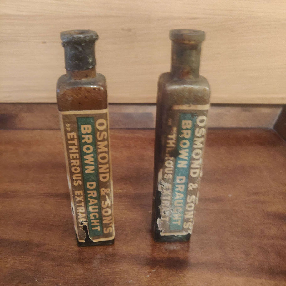 Antique probably world war one pair of horse medicine bottles by Osmond and son