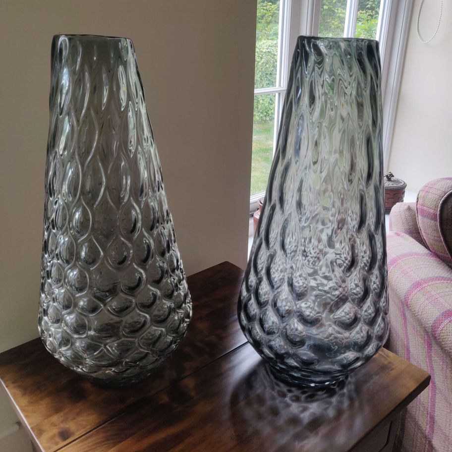 Discover the timeless elegance of a vintage tall art glass coloured vase.