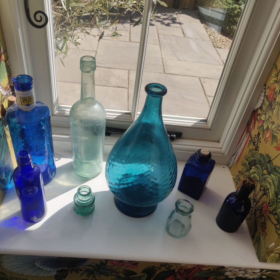 Vintage large green decorative glass bottle