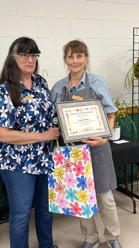 Victoria Hewitt receiving her AOS appreciation award at the TOC May 2025 meeting