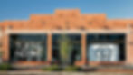 tuft & needle storefront with wordmark and logo mark displayed on the windowds