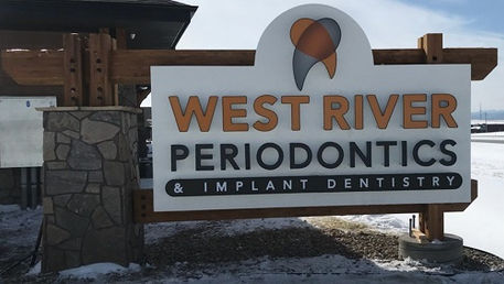 Routed and textured to background to shape with channel letter/logo mounted on top