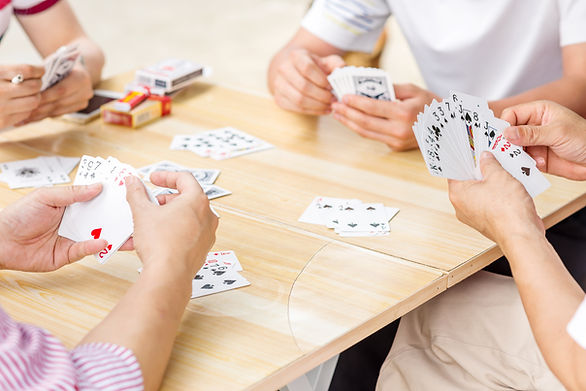 Group of friends playing cards