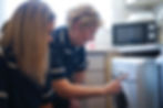 Crystal Care carers completing washing machine household services