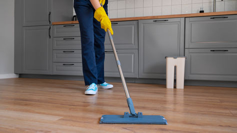 person cleaning floor