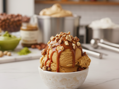 Salted caramel gelato scoop with caramel drizzle and praline pieces