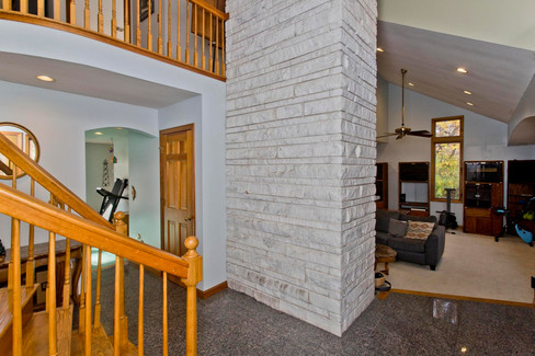 back of fireplace, family room and formal living room view 