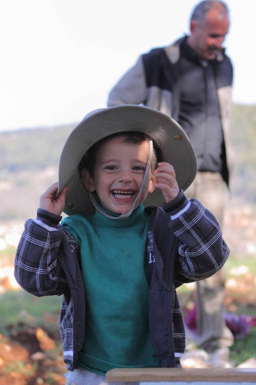 Hat thief smiling boy